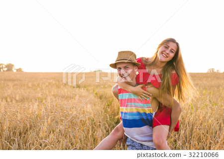 Happy Couple Having Fun Outdoors on wheat field 32210066