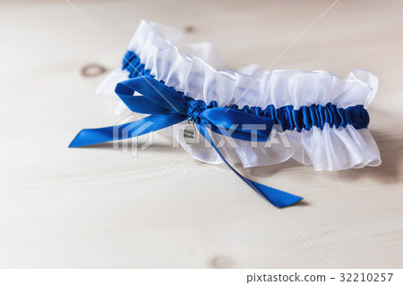 Bride's garter. Traditional symbolic accessory 32210257