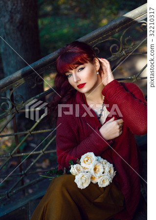 Girl sitting on old house stairs Girl sitting on old house stairs 32210317