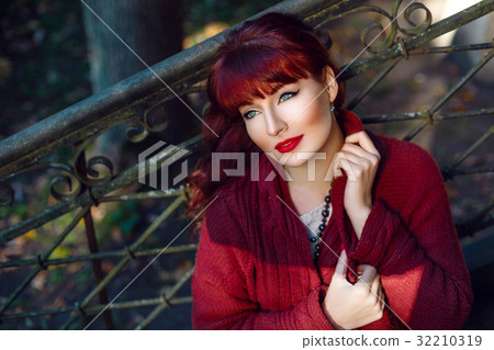 Girl sitting on old house stairs 32210319