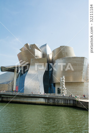 Spanish Guggenheim Museum stands along the Bilbao River Spanish Guggenheim Museum stands along the Bilbao River 32211184