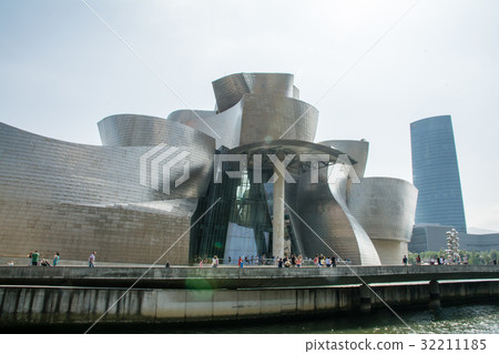 Spanish Guggenheim Museum stands along the Bilbao River Spanish Guggenheim Museum stands along the Bilbao River 32211185