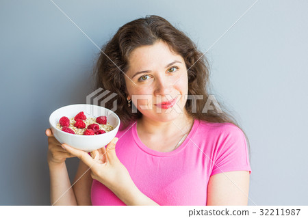 Smiling woman hold healthy and natural breakfast Smiling woman hold healthy and natural breakfast 32211987