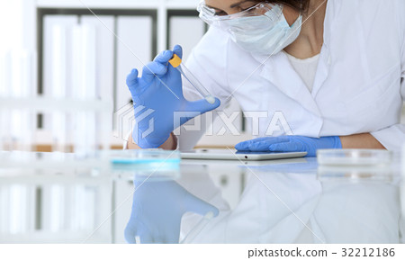 Close up of scientific research hands with clear 32212186