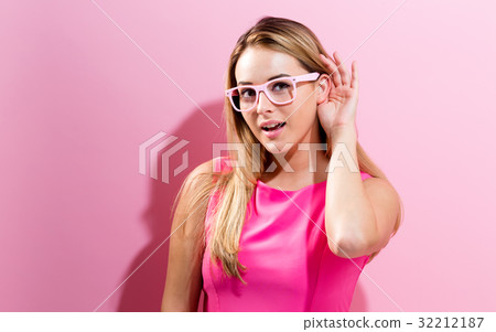 Young woman listening  32212187