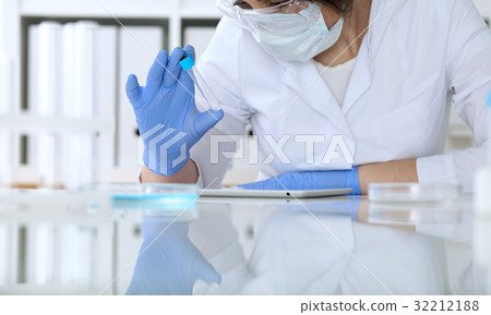 Close up of scientific research hands with clear 32212188