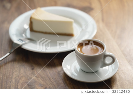 fresh espresso and cheesecake on table fresh espresso and cheesecake on table 32212480