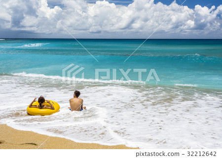 Vacation couple on beach together Vacation couple on beach together 32212642