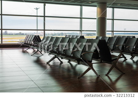 Empty airport terminal waiting area with chairs. Empty airport terminal waiting area with chairs. 32213312
