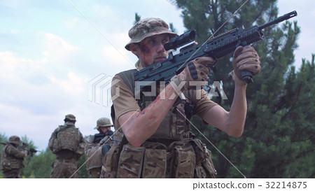 Military troop sitting and aiming 32214875