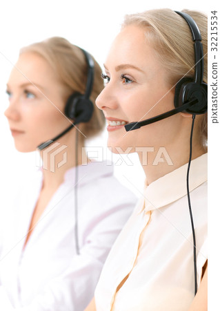 Call center. Focus on beautiful blonde woman in Call center. Focus on beautiful blonde woman in 32215534