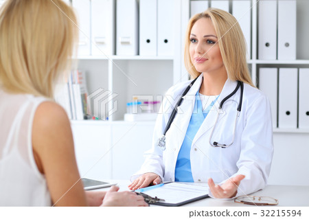 Doctor and  patient  discussing something whi 32215594