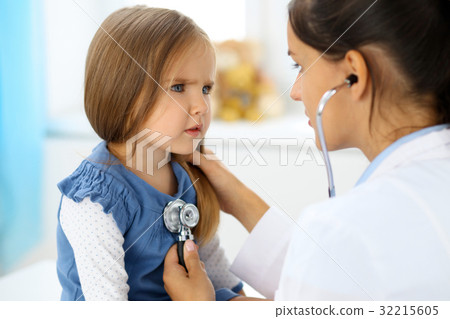 Doctor examining a little girl by stethoscope 32215605