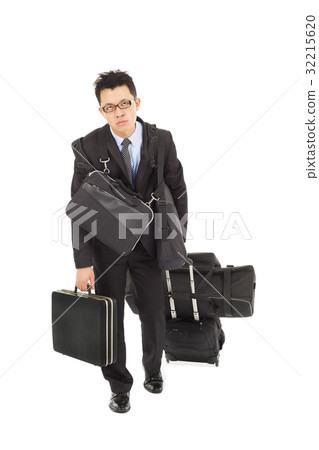 exhausted businessman taking bags and suitcases exhausted businessman taking bags and suitcases 32215620