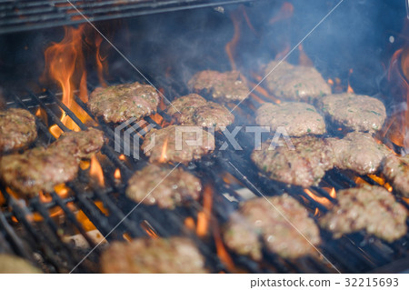 burgers on grill , flaming barbecue hamburgers burgers on grill , flaming barbecue hamburgers 32215693