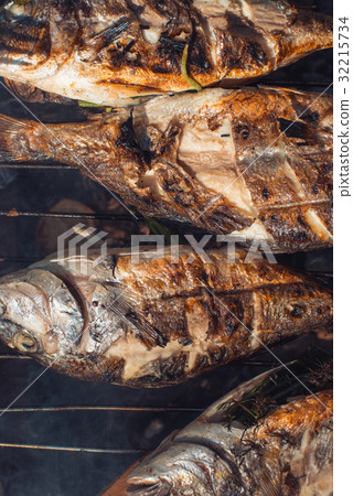 Grilled fish with lemon on the grid Barbeque in 32215734