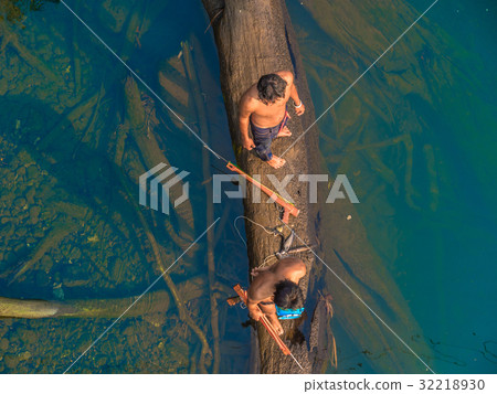 fisherman hunt fish by gun in Kwai river 32218930