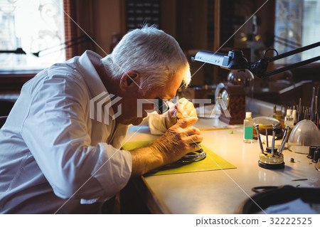 Horologist repairing a watch 32222525