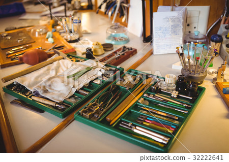 Horologist workshop with clock repairing tools, equipments and machinery Horologist workshop with clock repairing tools, equipments and machinery 32222641