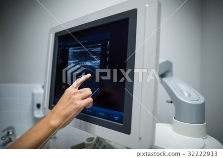 Nurse pointing at ultrasonic monitor 32222913