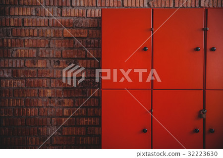 Lockers placed against brick wall Lockers placed against brick wall 32223630