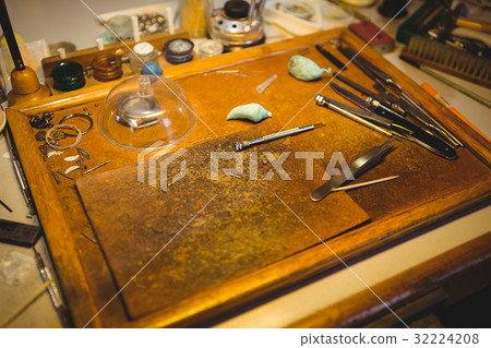 Horologists workshop with clock repairing tools 32224208