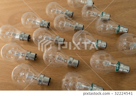 Electric bulbs on wooden plank 32224541