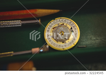 Horologists workshop with clock repairing tools 32224545