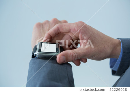 Businessmans hands checking smart watch 32226928