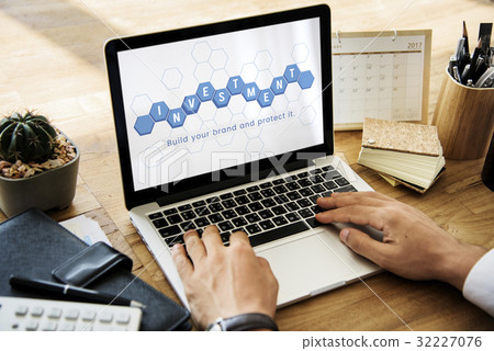 Hands working on laptop network graphic overlay 32227076