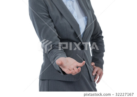 Businesswoman gesturing against white background Businesswoman gesturing against white background 32227167
