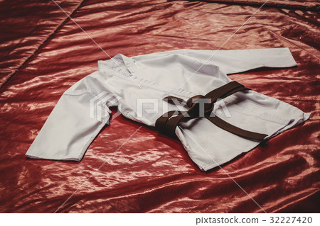 Karate uniform and brown belt 32227420