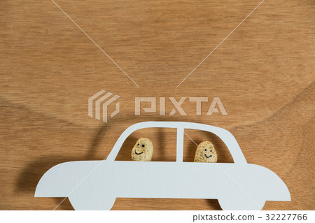Two peanut figurine travelling in car Two peanut figurine travelling in car 32227766