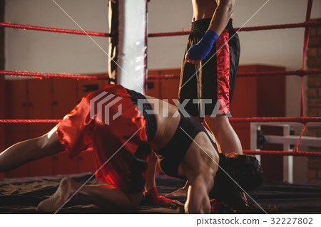 Two female boxers fighting in the ring Two female boxers fighting in the ring 32227802
