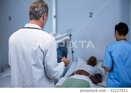 Doctor analyzing x-ray in ward 32227831