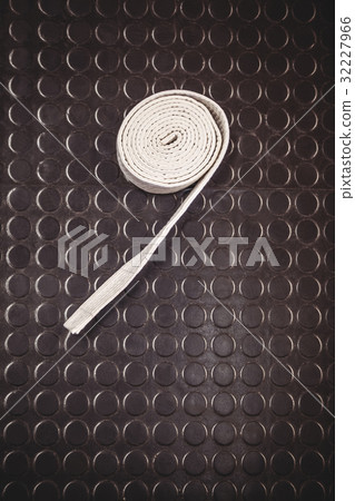 Karate white belt on metallic background 32227966