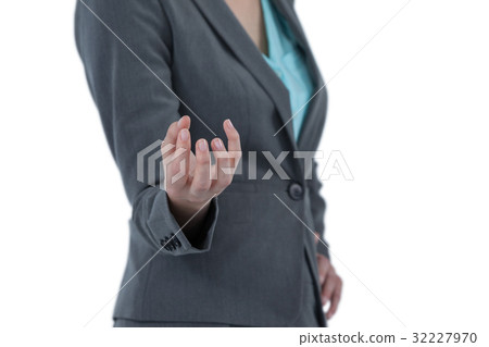 Businesswoman gesturing against white background 32227970