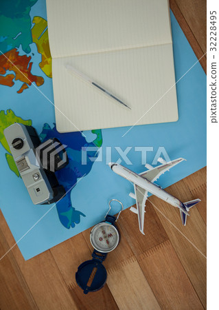 Digital camera, dairy, pen, map, compass and airplane model Digital camera, dairy, pen, map, compass and airplane model 32228495