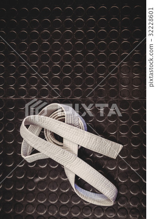 Karate white belt on metallic background Karate white belt on metallic background 32228601