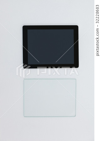 Close-up of digital tablet and glass sheet 32228683