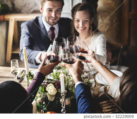 People Cling Wine Glasses on Wedding Reception with Bride and Groom People Cling Wine Glasses on Wedding Reception with Bride and Groom 32229009