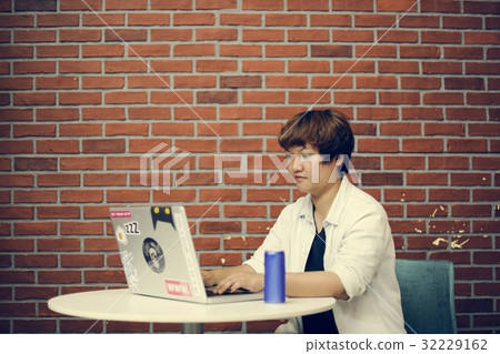 Woman working on laptop networking technology Woman working on laptop networking technology 32229162