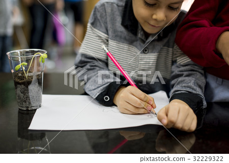 Group of diverse kindergarten students learning planting in science class Group of diverse kindergarten students learning planting in science class 32229322