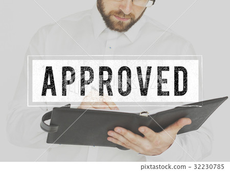 Businessman working and writing with approved word 32230785