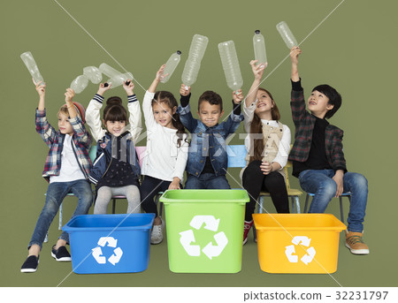 Kids and plastic bottles in a recycle bin Kids and plastic bottles in a recycle bin 32231797