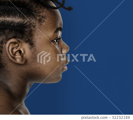 African little girl bare chest studio portrait in side view 32232189