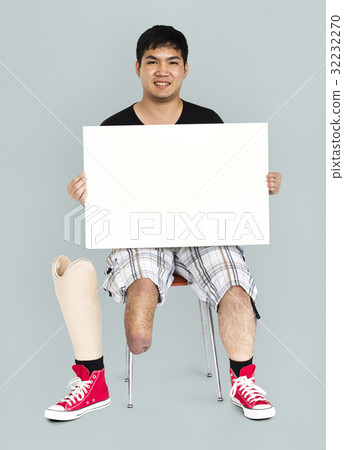 Disability Young Man with Prosthesis Leg Holding Blank Paper Board Studio Portrait Disability Young Man with Prosthesis Leg Holding Blank Paper Board Studio Portrait 32232270