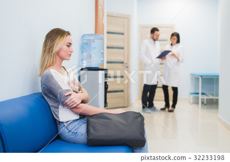 Young woman filling nervous sitting at hospital 32233198