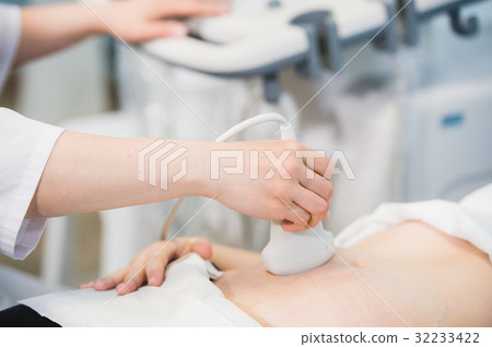 Close-up Of Doctor Moving Ultrasound Probe On Close-up Of Doctor Moving Ultrasound Probe On 32233422