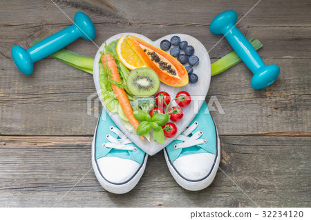 Healthy diet and sport concept with dumbbells Healthy diet and sport concept with dumbbells 32234120